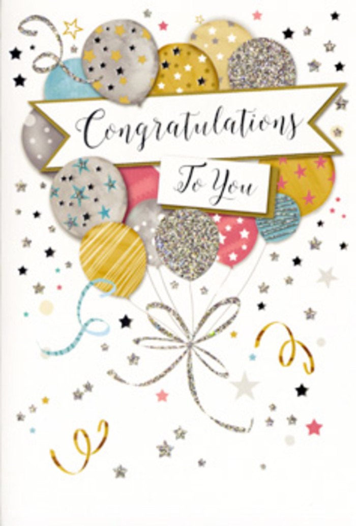 In this scene, a tall congratulations card stands like a miniature celebration, its front alive with the gentle lift of colourful balloons. The design is built around a layered bouquet of balloons in shimmering tones of gold, silver, champagne, sky blue, blush pink, and soft grey, reminiscent of the mixed pastel lights you might catch at dusk walking through Hither Green's quiet residential streets. Each balloon carries distinct decoration-fine metallic stripes, clusters of starlike dots, and patches of delicate glitter-so that no two shapes are quite the same. A soft, neutral background keeps the eye focused on the central display, where a flowing banner drapes elegantly across the middle of the card. On this banner, the phrase "Congratulations To You" is scripted in ornate, looping lettering that feels personal yet grand, as if written for one special person in a memorable moment. Surrounding the balloons, slender ribbons curl and spiral, while gold and silver stars drift like confetti across the page, suggesting music, laughter, and a room full of smiles. The finish of the card suggests a slight texture, with glimmering areas that would catch the light from a nearby window, much like sunlight filtering into a local Hither Green café. The atmosphere is one of poised celebration-refined but full of genuine joy-ideal for marking milestones such as graduations, promotions, or new beginnings. As a florist accustomed to preparing flowers for local celebrations, I see this card as a natural companion to a fresh bouquet delivered across SE13, completing a thoughtful, memorable gift.